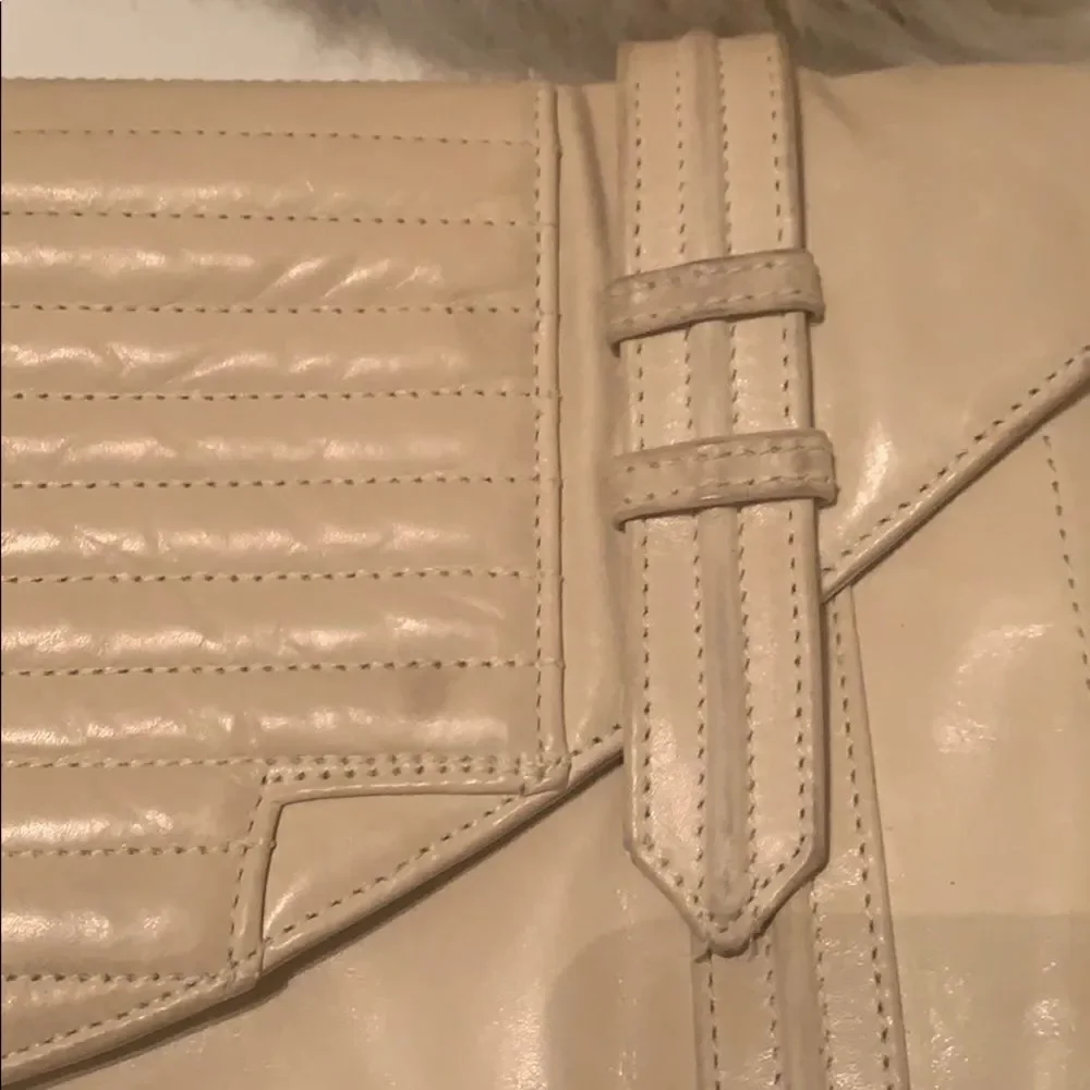 Reece Hudson cream colored clutch‎